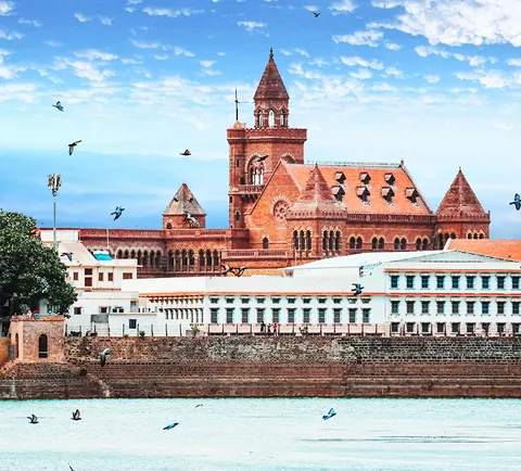 The royal palace complex of Bhuj, with its clock tower, seen across the water