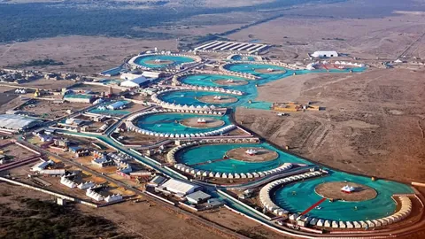 Aerial view of the Rann Utsav tent city at Dhordo, with rings of tents around open courts
