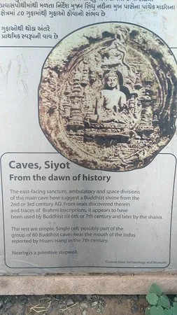 Gujarat State Archaeology signboard at the Siyot Caves describing their Buddhist origins